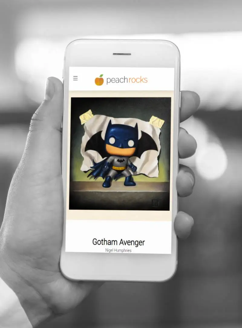 Product Page. A Hand Holding a Mobile Phone with the Gotham Avenger Artwork.